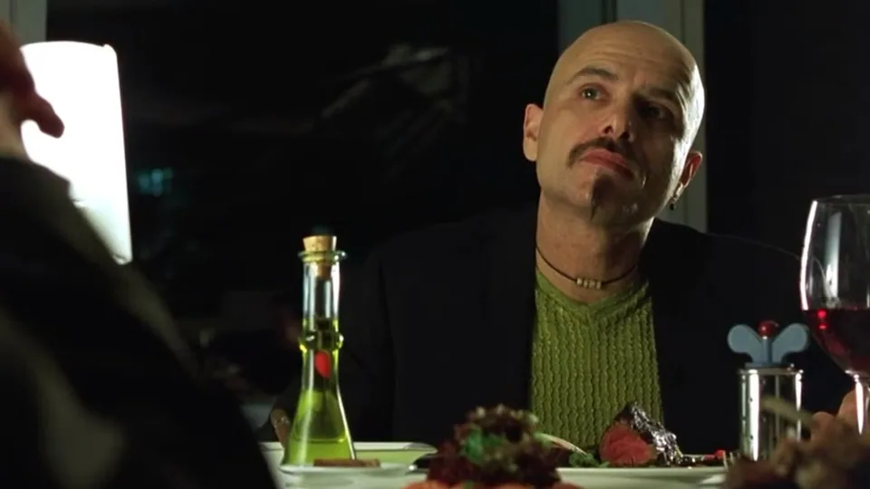 Still from The Matrix illustrating Cypher Chooses the Steak