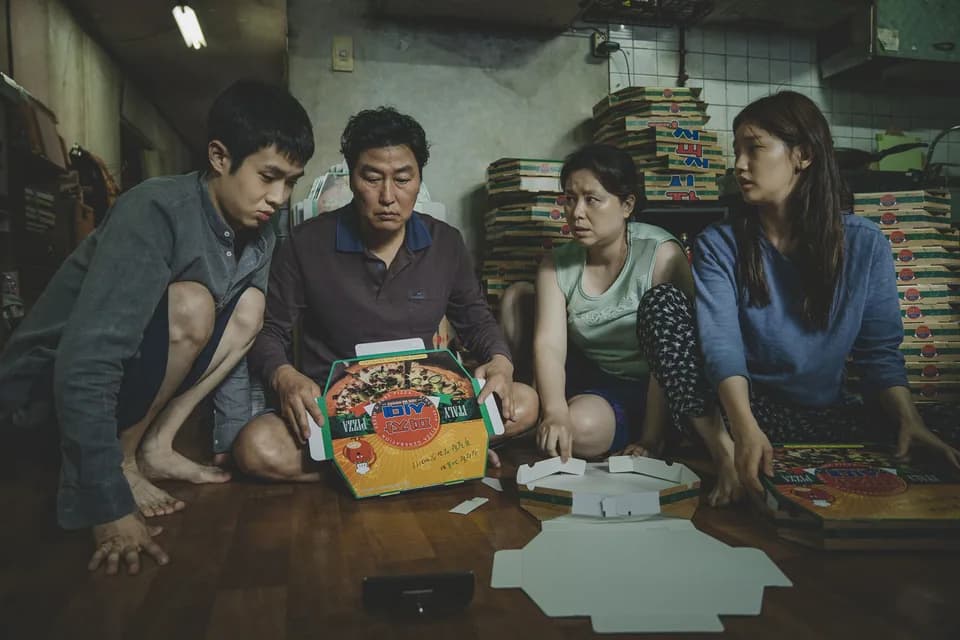 Still from Parasite illustrating The Kims Pass Every Check