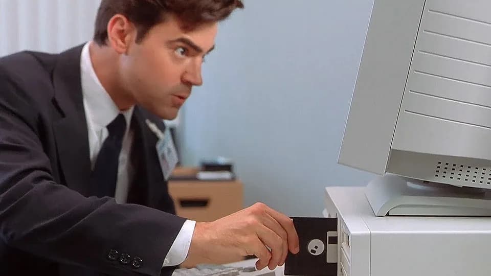 Still from Office Space illustrating The Decimal-Place Bug